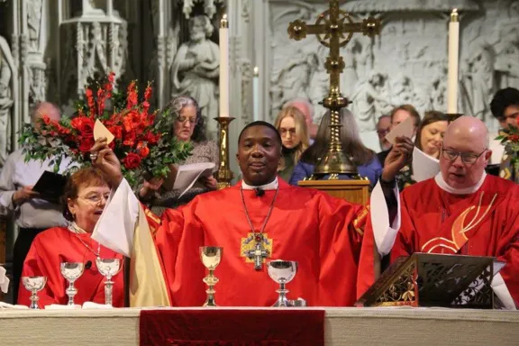 bishohp breaking bread